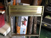 Folding sawbench with chainsaw attachment